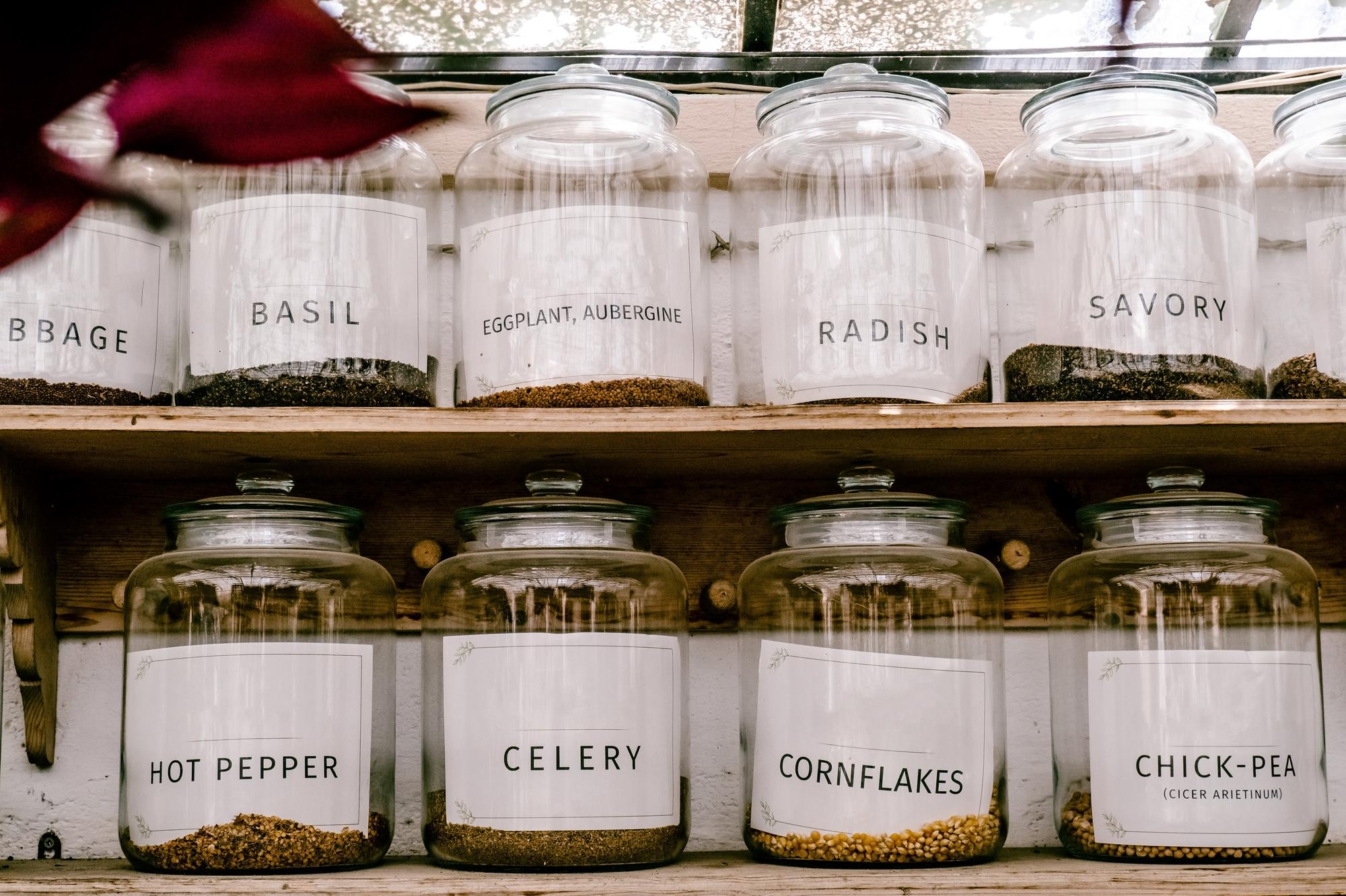 Close-up of handcrafted preserves and labels on wooden table