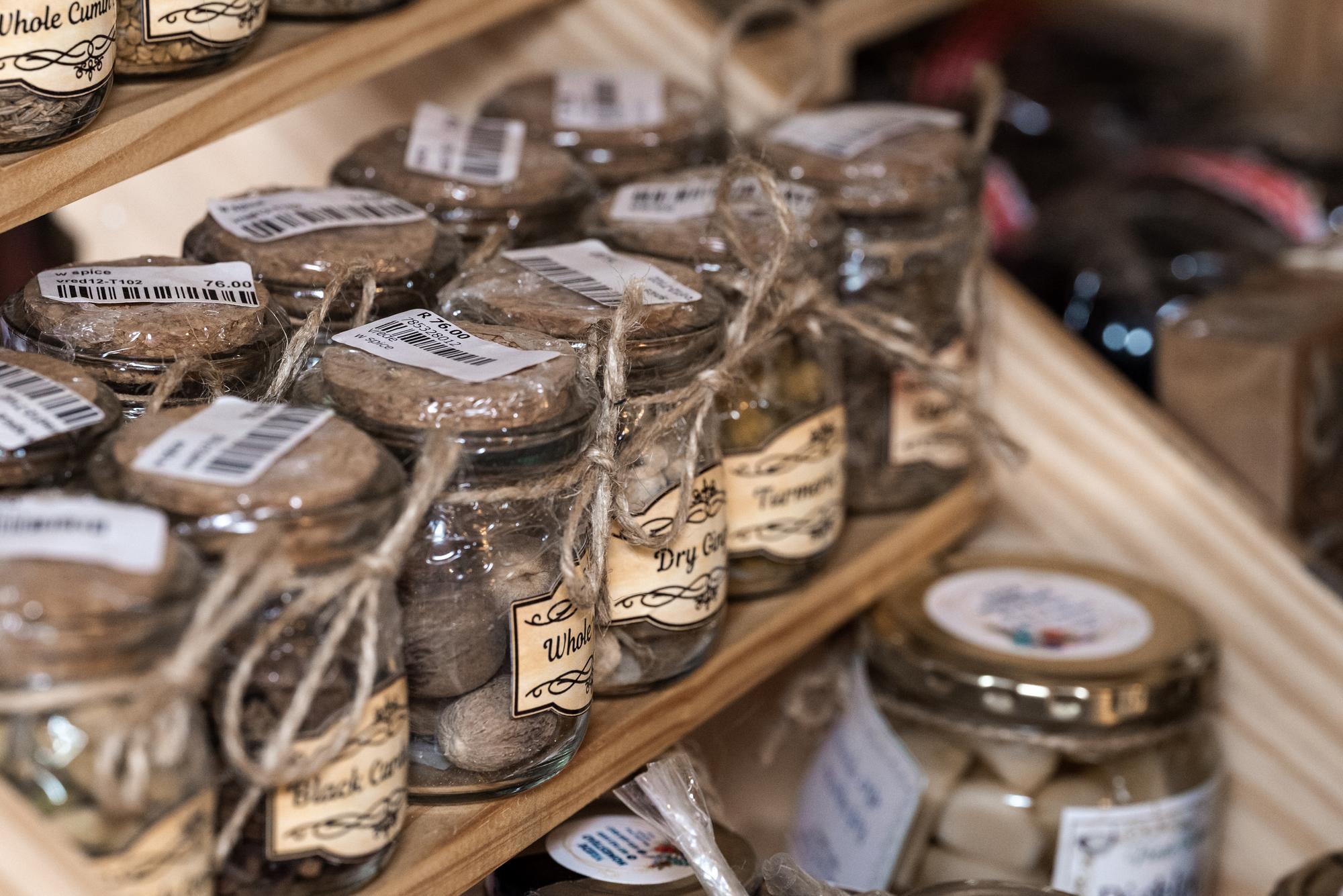 Rows of labeled jars on shelf